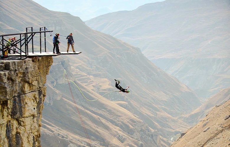 Making a bungee jump from a towering cliff