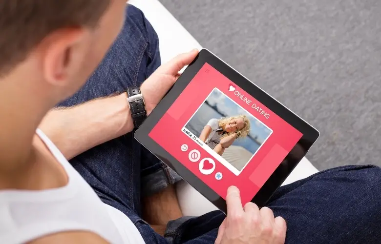 Man using online dating app on a tablet