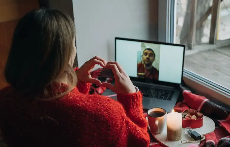 Woman using dating app on a laptop