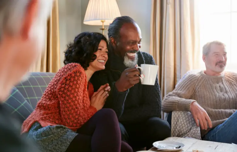 Middle aged couple having fun with friends