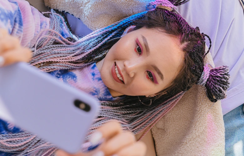 A woman taking a selfie for her dating profile